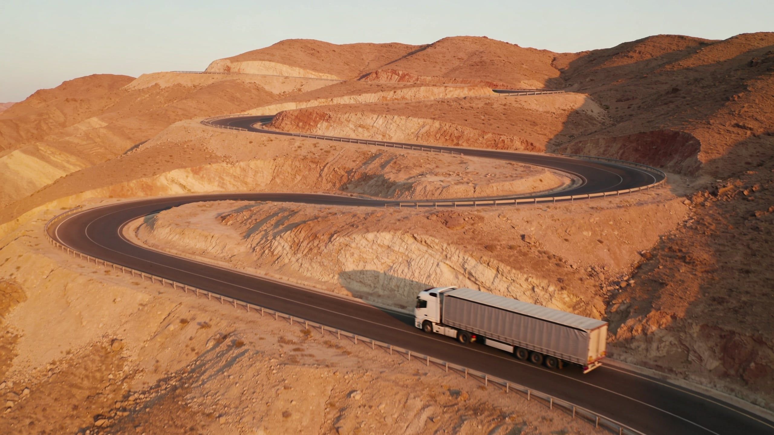 Truck on a mountain pass, aerial view